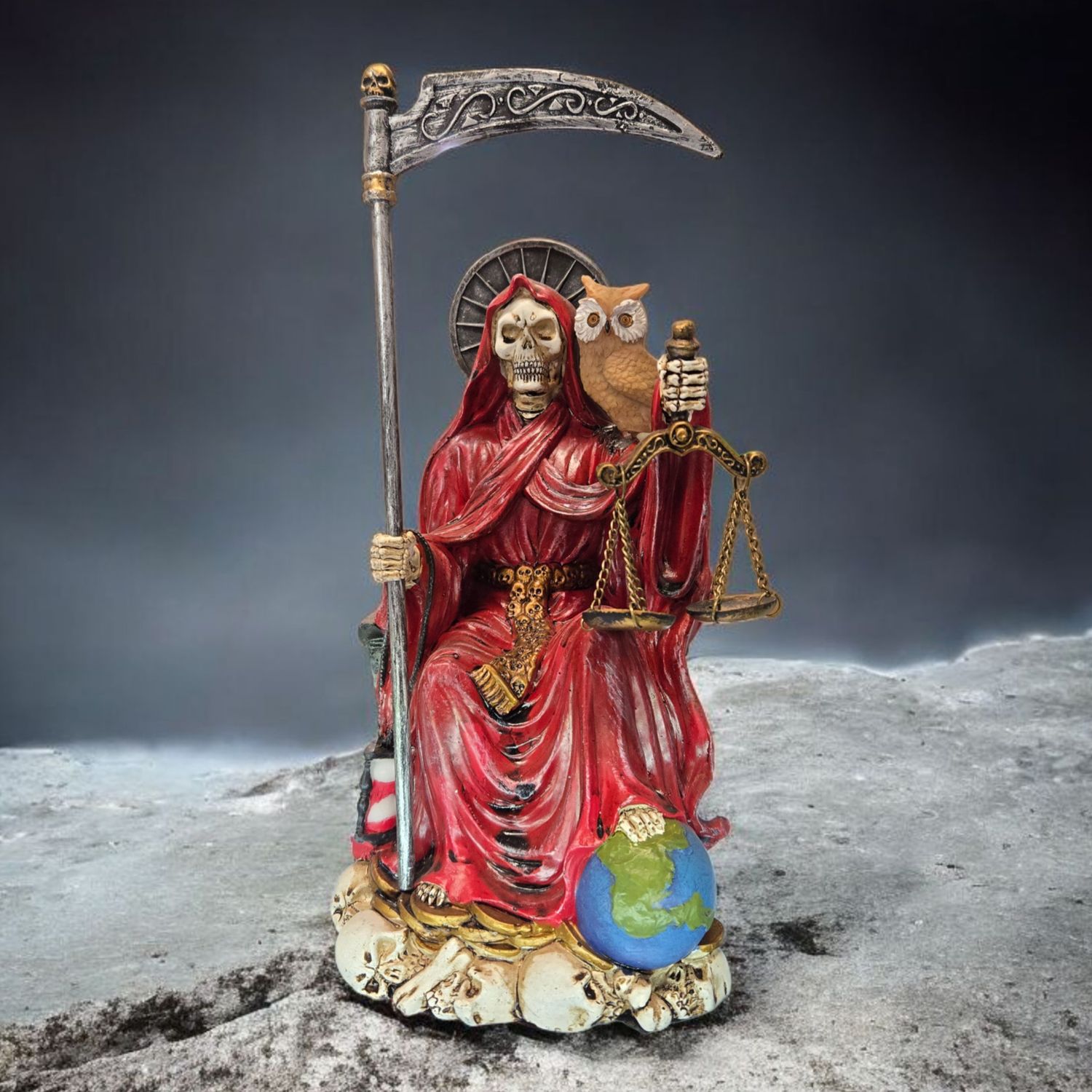 Hand-painted Santa Muerte red sitting statue with scythe, scales, and owl, symbolizing love, courage, and protection.