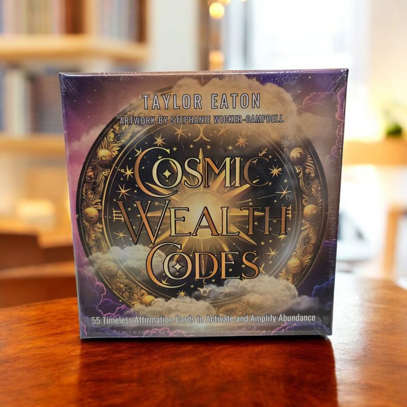 Cosmic Wealth Codes affirmation card deck front with celestial wealth wheel artwork and abundance symbolism