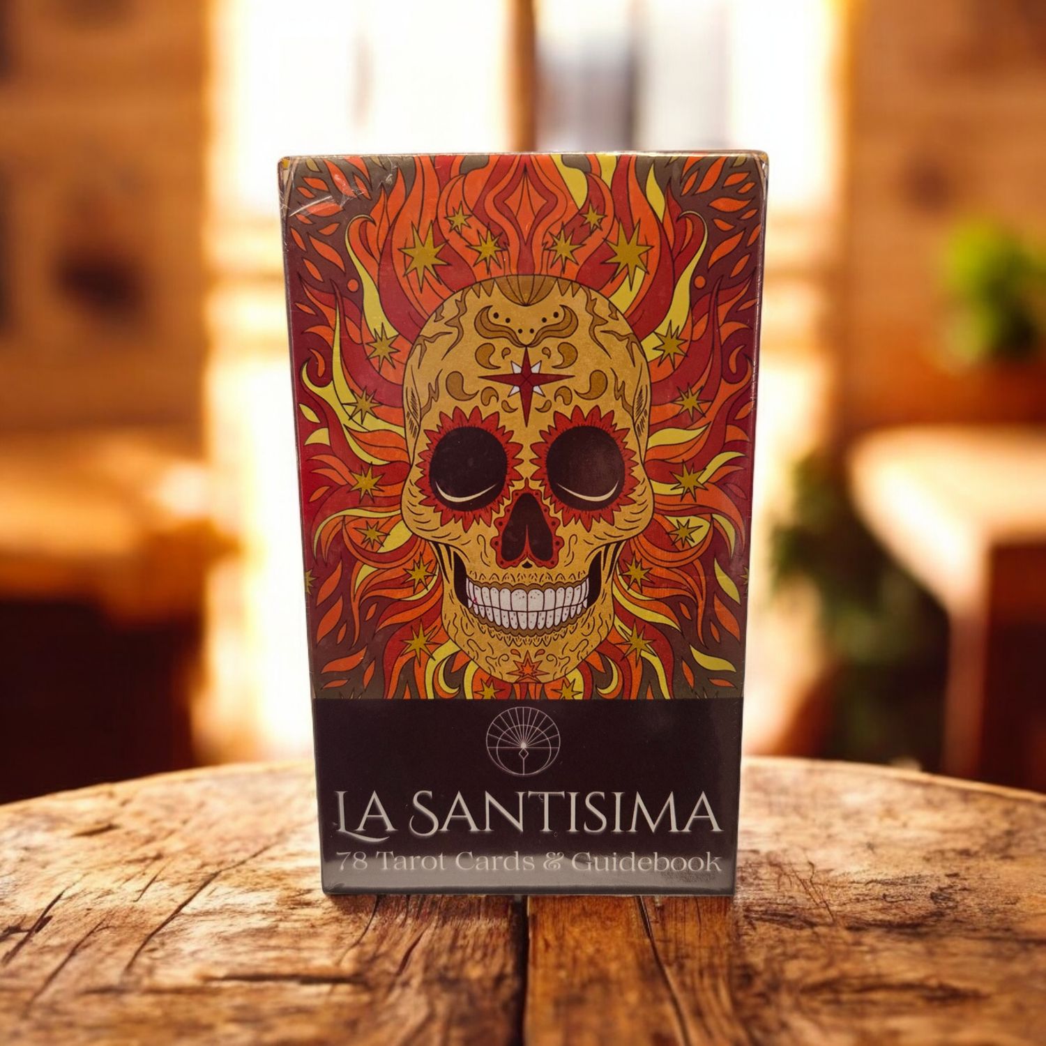 La Santísima Tarot deck front showing colorful flaming skull artwork inspired by Day of the Dead symbolism