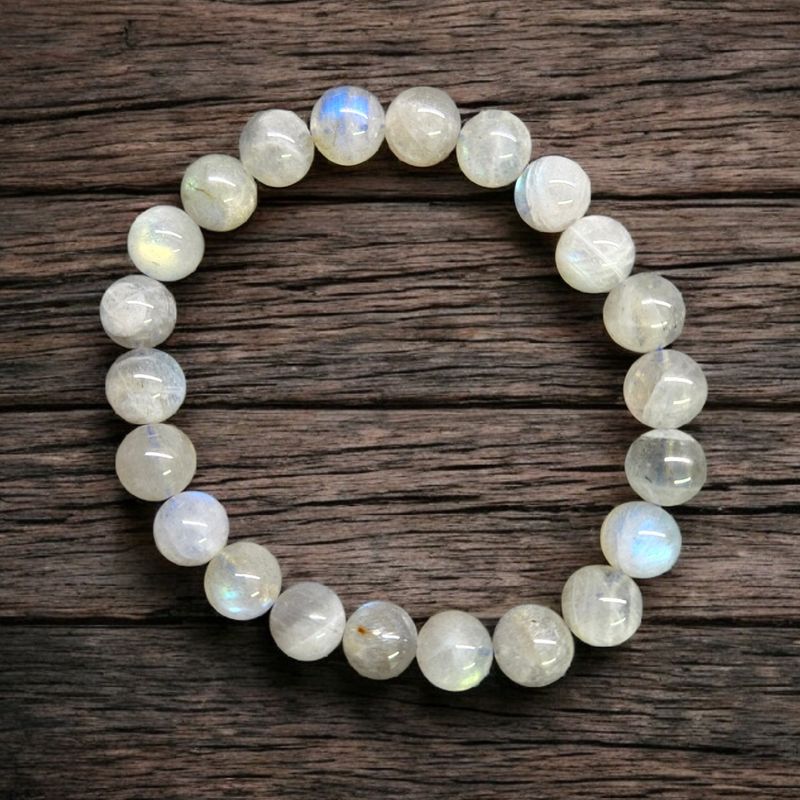 Sunset Labradorite 10mm stretch bracelet with polished iridescent round beads photographed on rustic wooden background