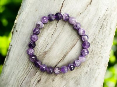 CHEVRON AMETHYST 8MM BRACELET Chevron Amethyst 8mm round bead stretch bracelet displayed on textured wood background