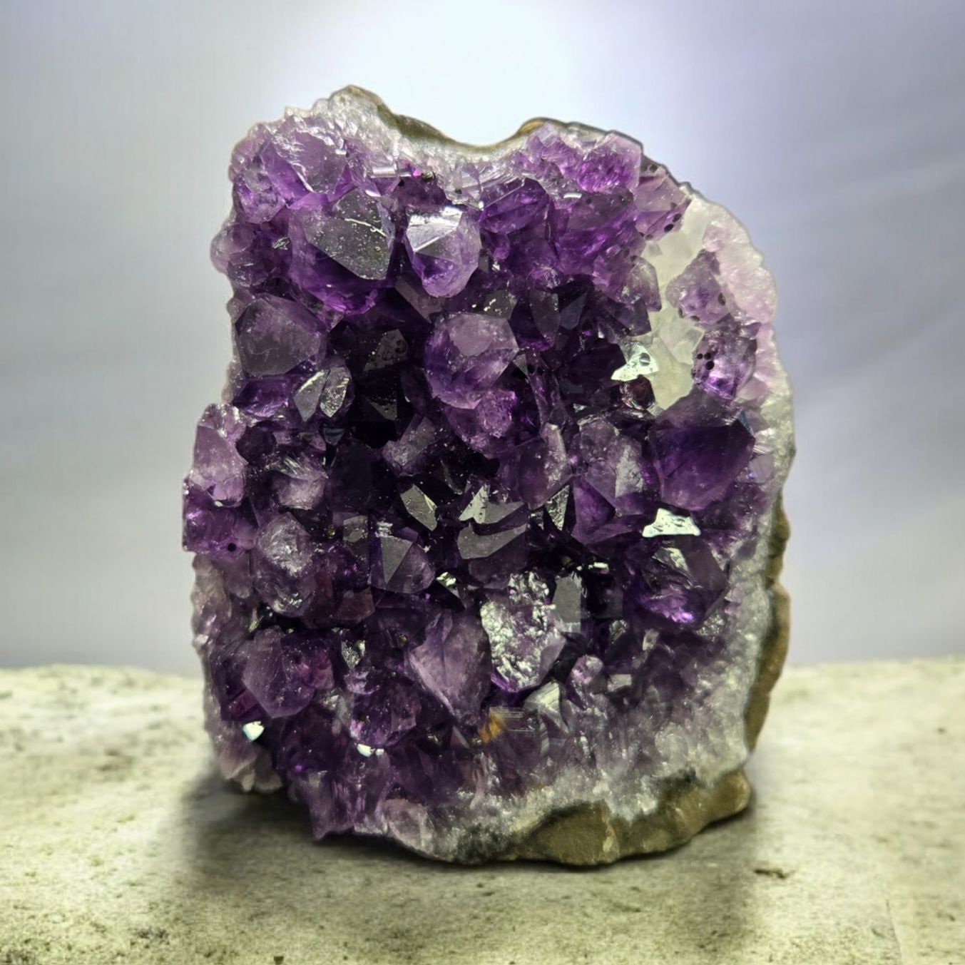 A+ URUGUAY AMETHYST DRUZY CUT BASE B A+ Uruguay Amethyst druzy cut base with deep purple crystal points and natural polished standing base