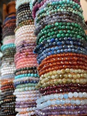 Colorful gemstone bead bracelets stacked together, natural crystal stretch bracelets for healing energy and spiritual balance