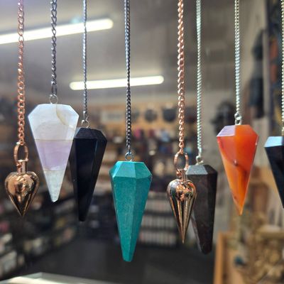 Crystal and gemstone pendulums displayed at Arkady’s Metaphysical Gifts in Amarillo