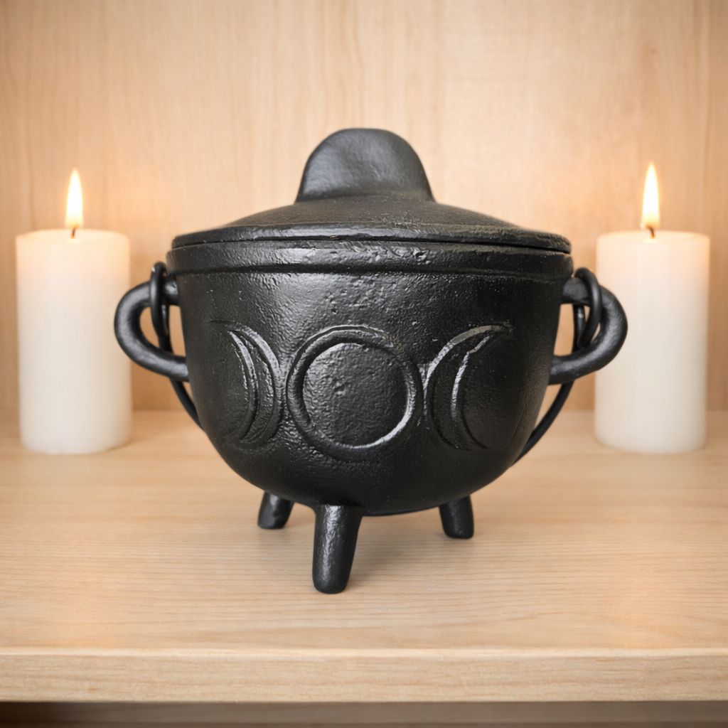 TRIPLE MOON LG CAULDRON Cast iron triple moon cauldron with lid on wooden altar with candles from Arkadys Metaphysical Gifts Amarillo TX