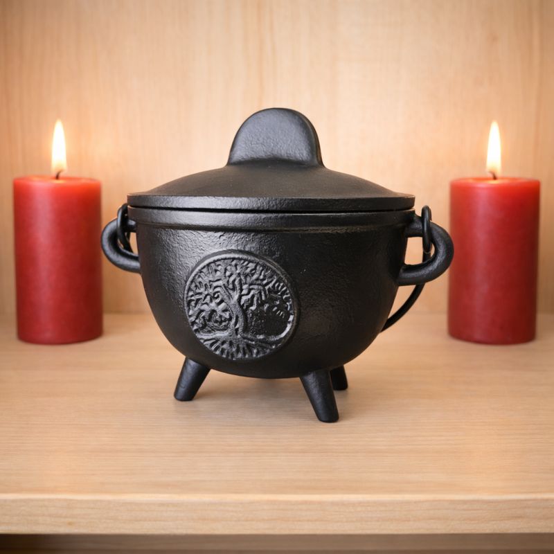 Cast iron tree of life cauldron with lid on wooden altar with candles from Arkadys Metaphysical Gifts Amarillo TX