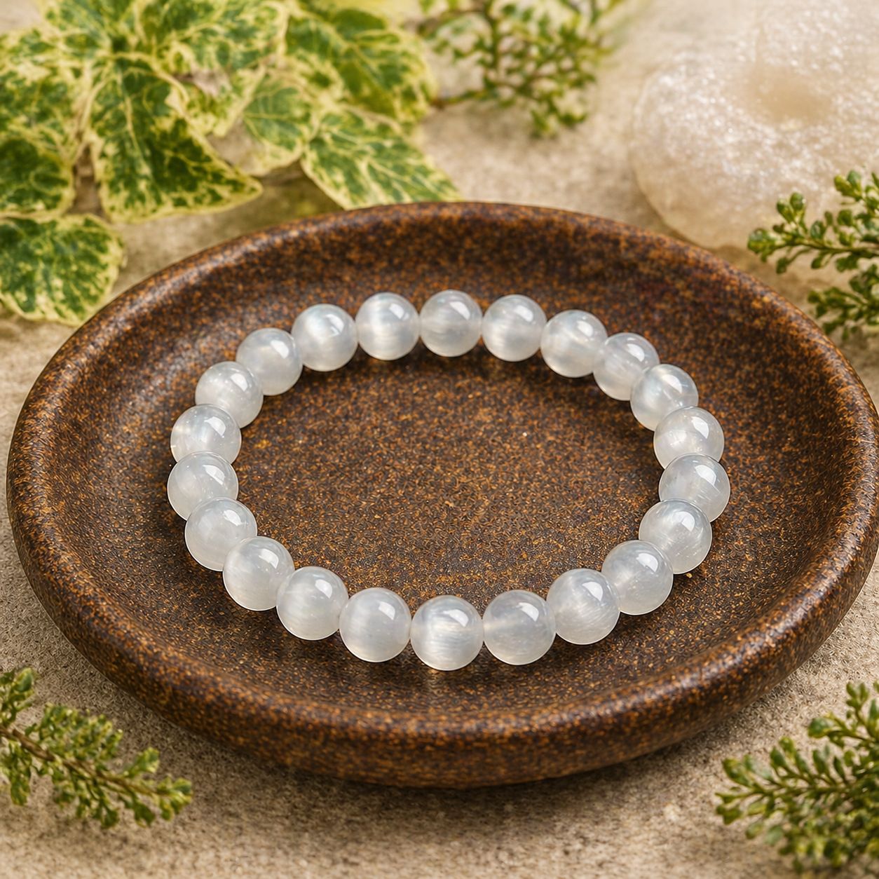 8mm selenite beaded stretch bracelet in wooden bowl at Arkadys Metaphysical Gifts Amarillo, Texas
