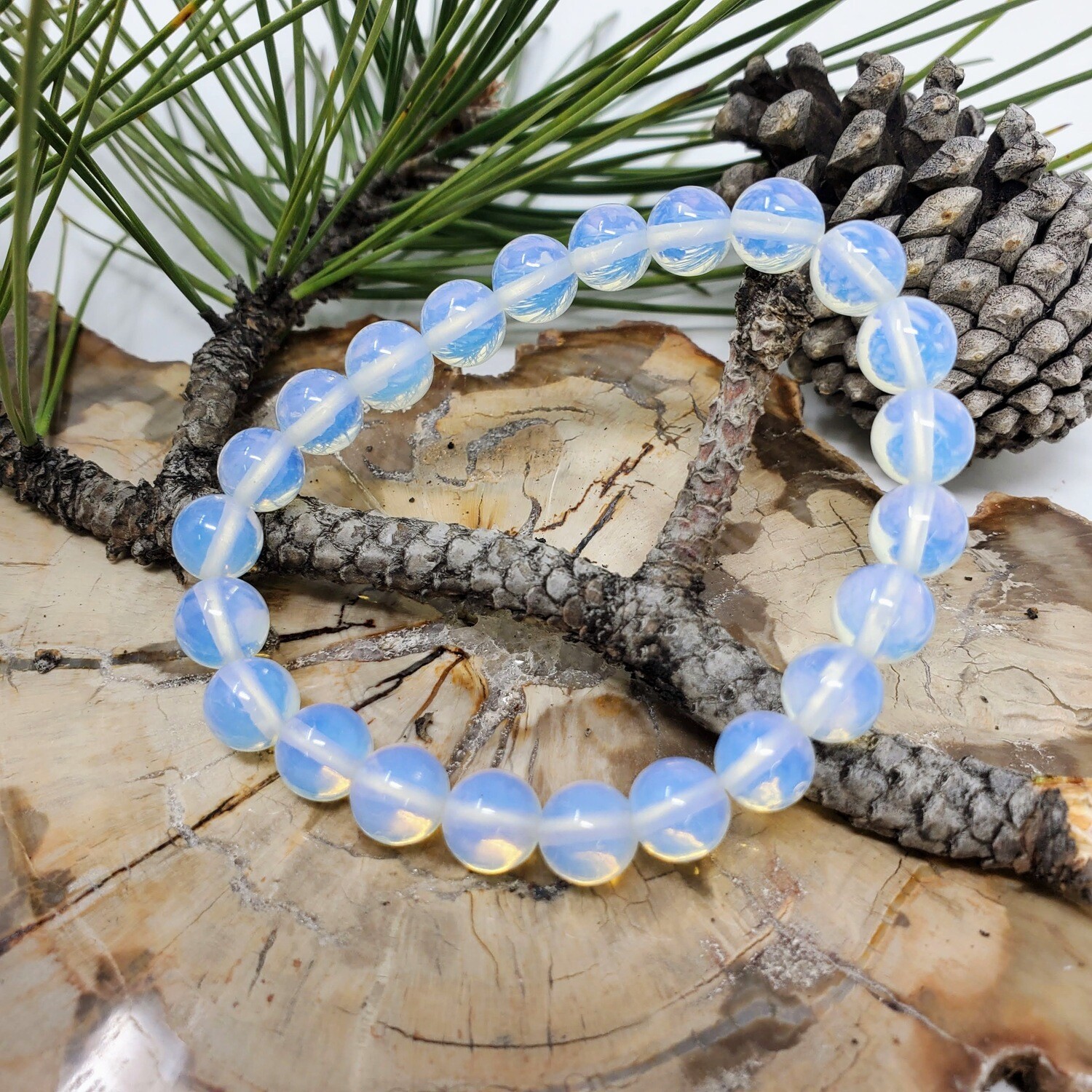 Opalite 8mm stretch bracelet with luminous white beads and soft blue and pink flashes
