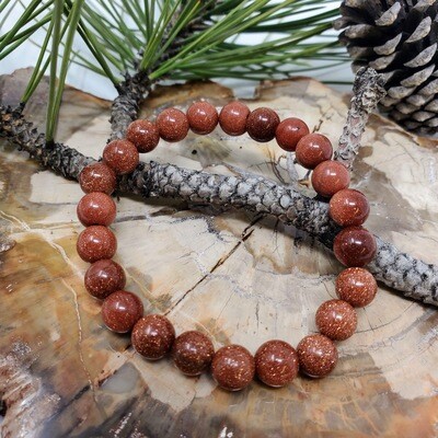 Red goldstone 8mm stretch bracelet with sparkling reddish-brown beads and copper-colored flecks