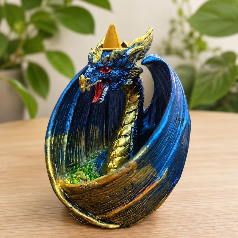 Dragon Wrap Wings LED Back Flow Burner on a wooden table.