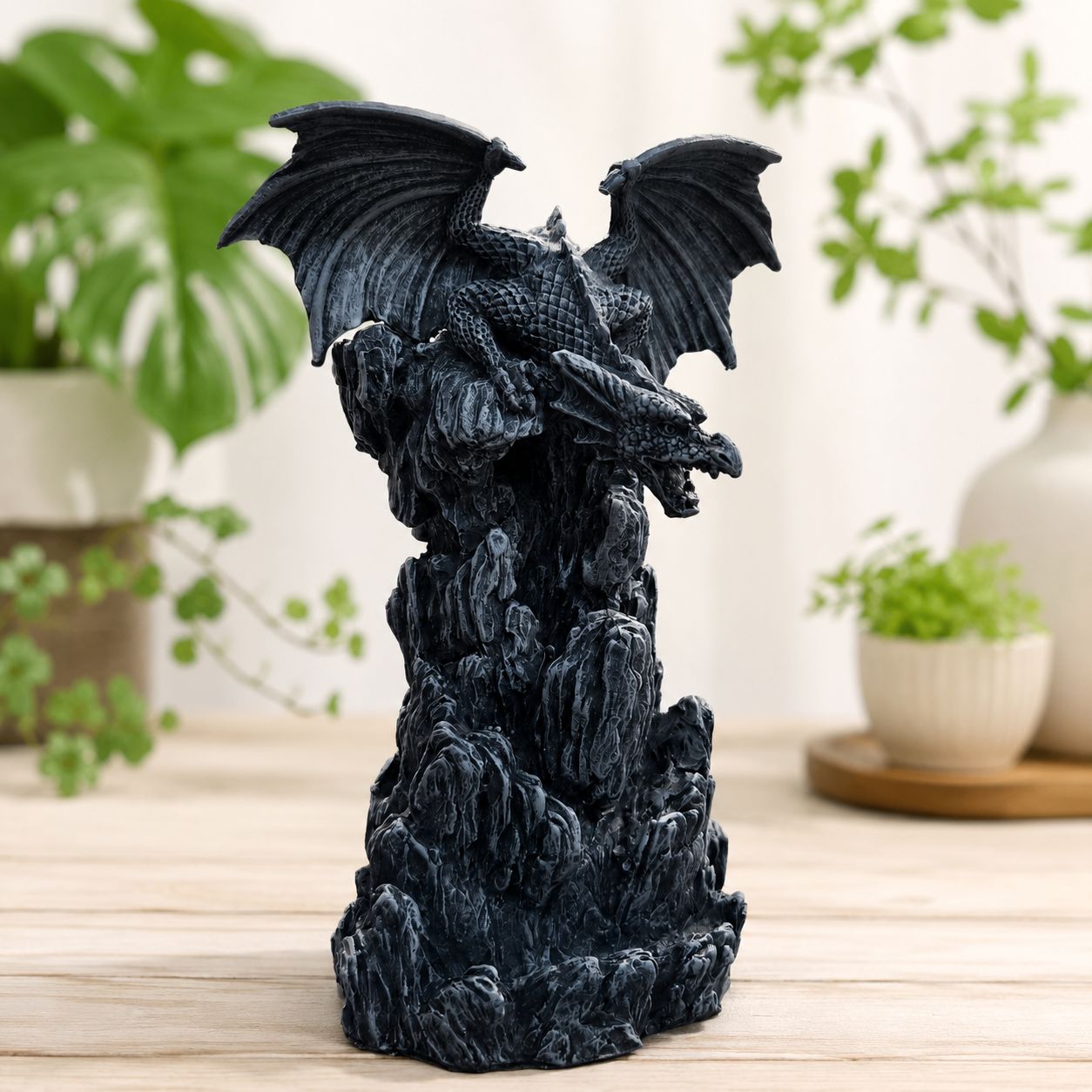 Grey Dragon Back Flow Burner on wooden table.