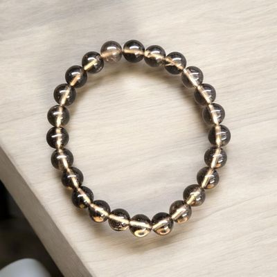 Smoky Quartz 8mm gemstone bracelet with polished translucent brown beads.