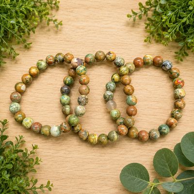 Multiple rainforest Jasper Rhyolite 8mm bracelets with polished green, brown, rust and cream beads.