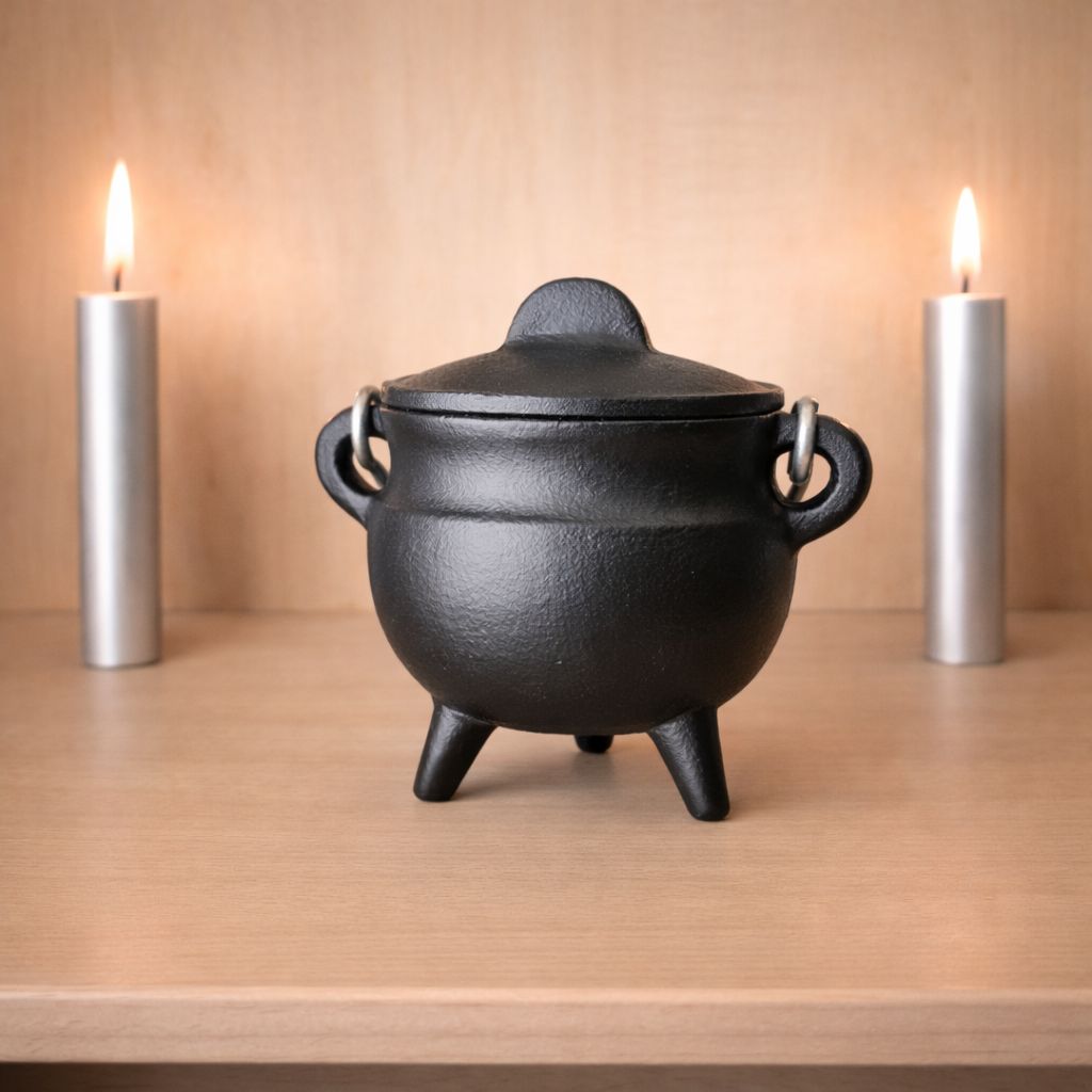 Small cast iron cauldron with lid on wooden altar with candles from Arkadys Metaphysical Gifts Amarillo TX