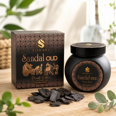 Sonavi Sandal Oud Bakhoor incense chips 40g black and copper box on a light wooden table.