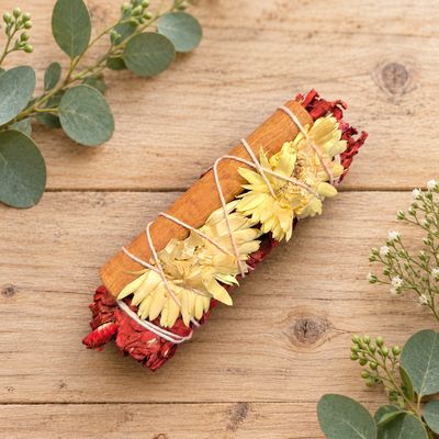 Dragon’s Blood protection and prosperity smudge with white sage, cinnamon and yellow flowers