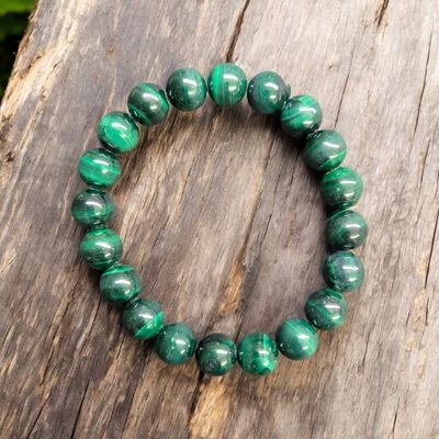 Malachite 10mm gemstone bracelet with polished green banded beads on stretch cord