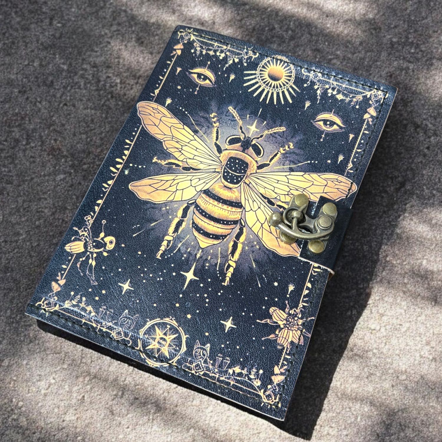 Honeybee leather journal with latch and celestial bee design at Arkadys Metaphysical Gifts metaphysical shop in Amarillo.