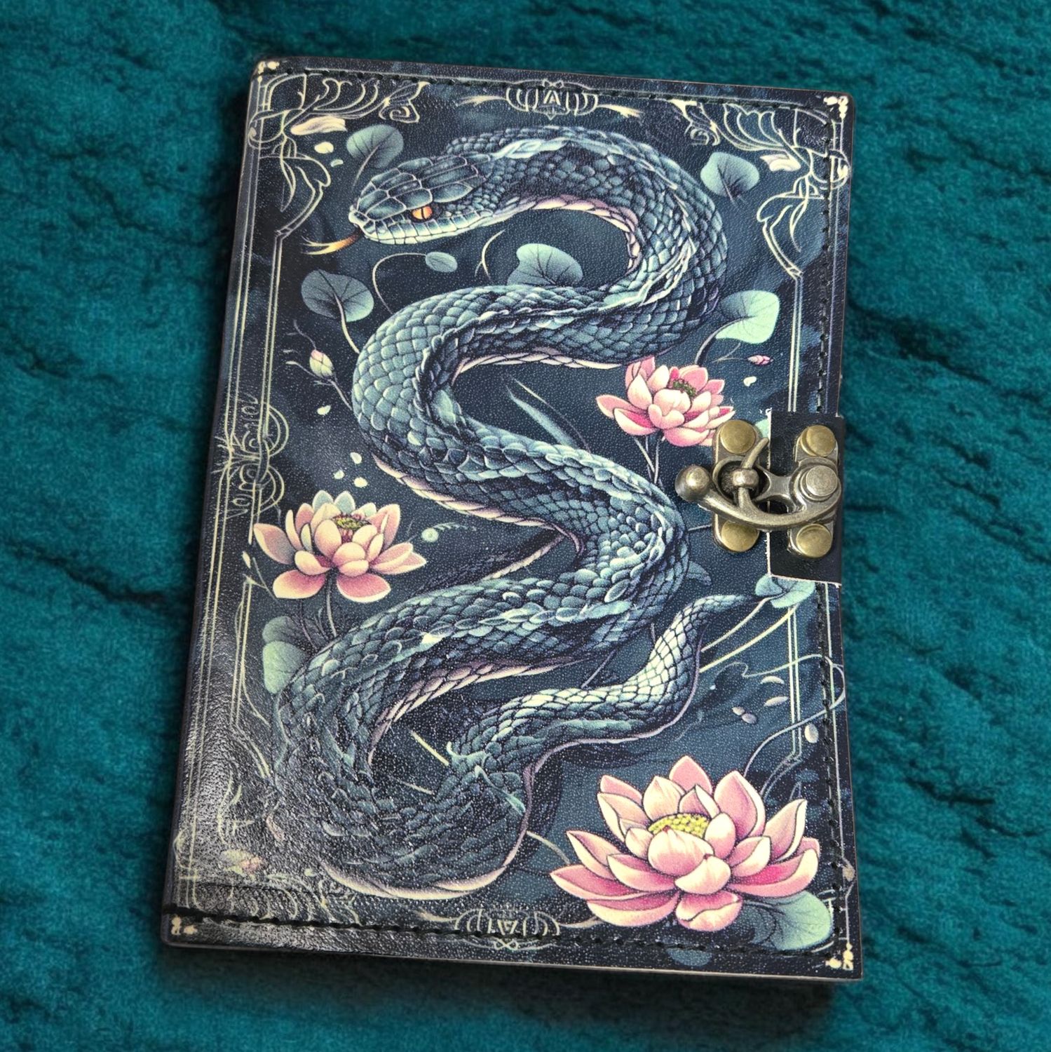Snake lotus leather journal with latch at Arkadys Metaphysical Gifts metaphysical shop in Amarillo Texas