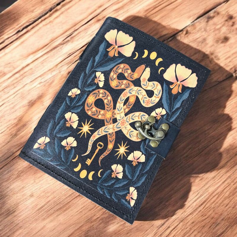 Snakes of Wisdom leather journal with serpent artwork at Arkadys Metaphysical Gifts metaphysical shop in Amarillo Texas