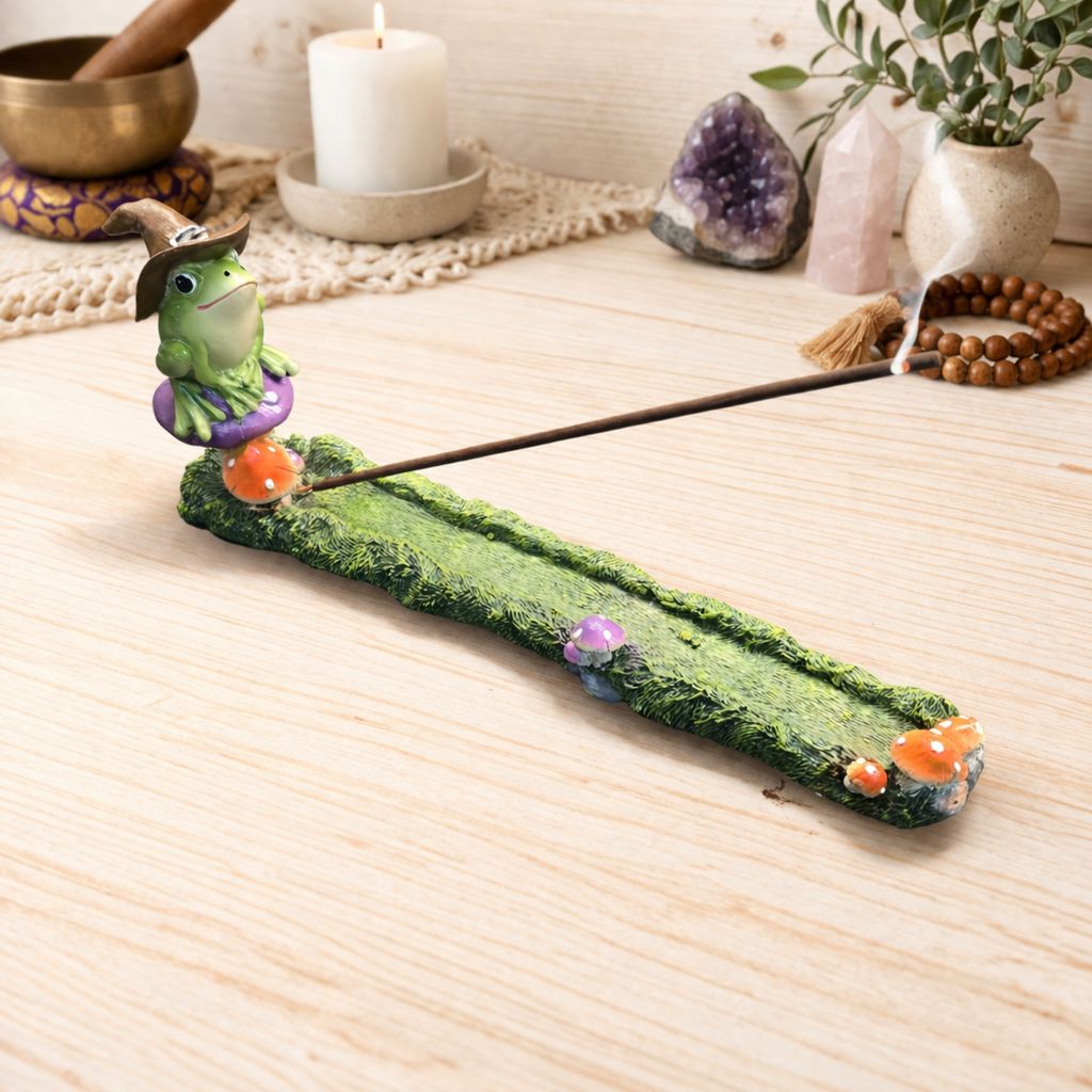 Magical frog incense burner resin stick holder on wooden altar with crystals and candle Arkadys Metaphysical Gifts