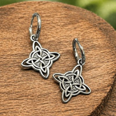 316L Witch’s Knot hinge hoop earrings on wood display from Arkadys Metaphysical Gifts Amarillo
