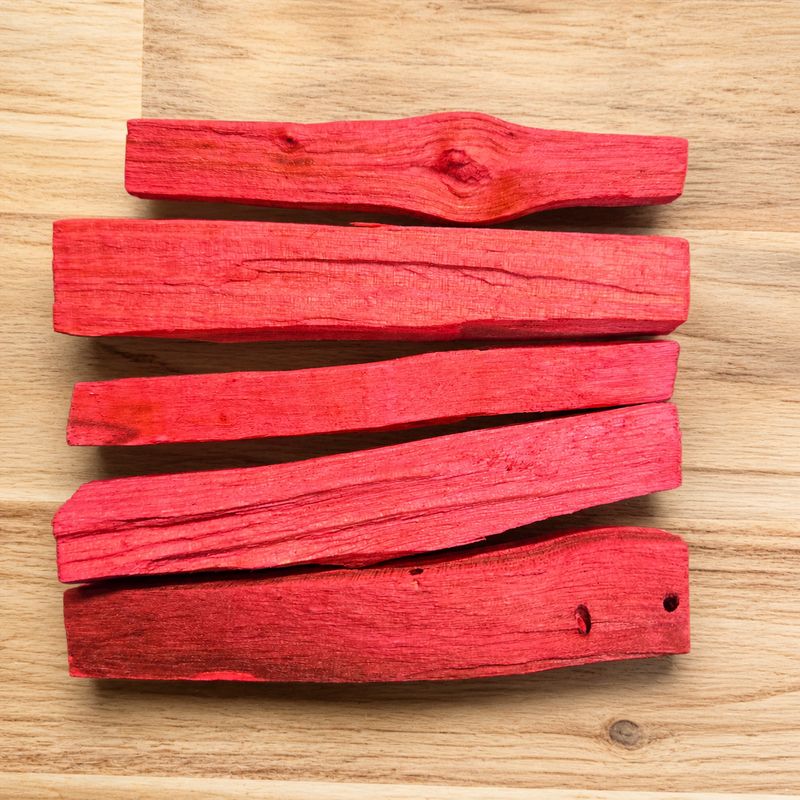 Dragon’s Blood infused Palo Santo sticks on wooden table at Arkadys Metaphysical Gifts Amarillo