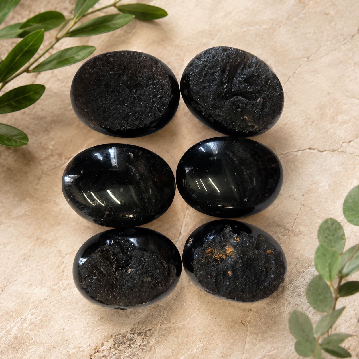 Half polished tektite palm stones with rough and smooth sides