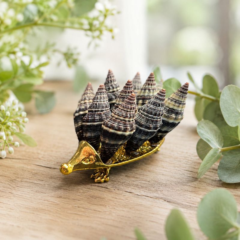 Shells hedgehog made with natural shells on gold-toned base