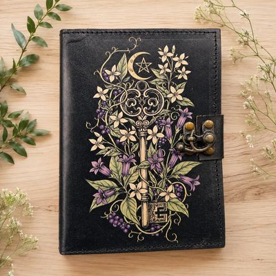 Botanical Key Leather Journal with blank pages and floral key design on black cover.