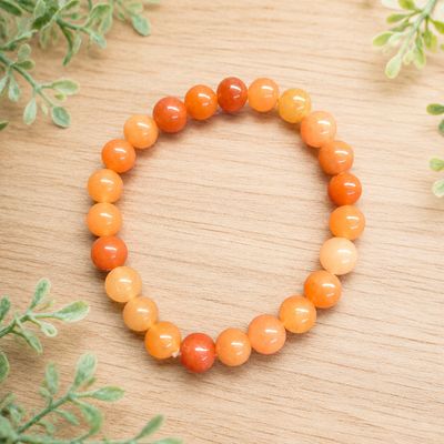 Orange Aventurine 8mm stretch bracelet with polished peach and orange gemstone beads.