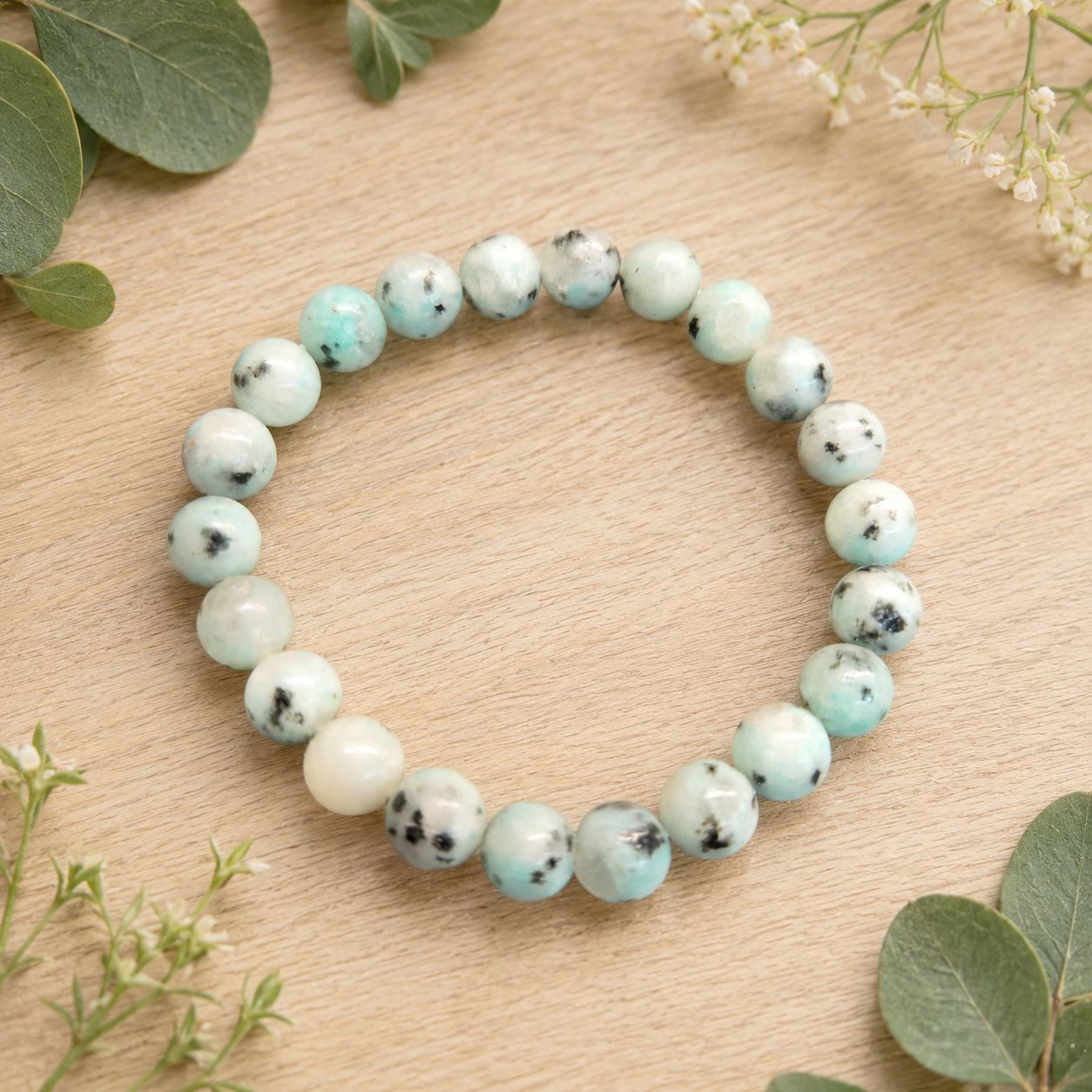 Kiwi Jasper 8mm stretch bracelet with pale mint, cream and black-speckled polished beads.