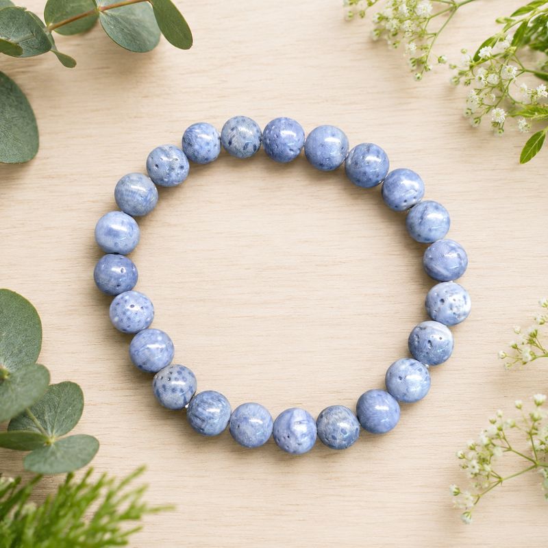 Blue sponge coral 8mm stretch bracelet with naturally pitted and mottled blue beads.