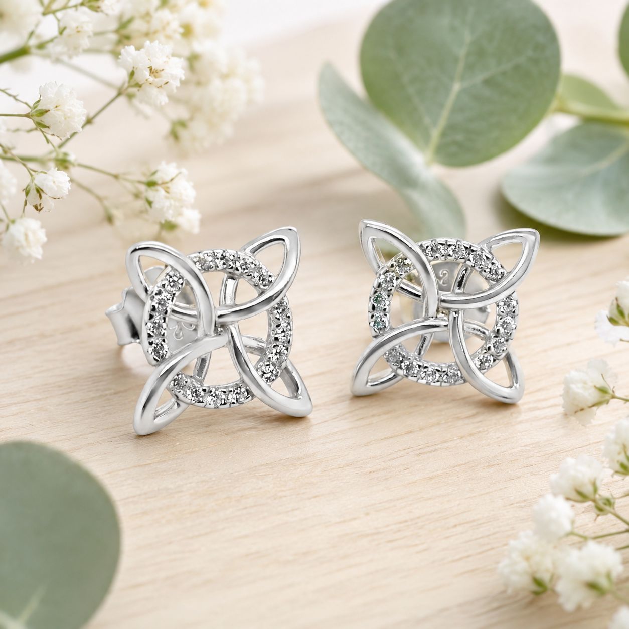 925 sterling silver Witch’s Knot stud earrings with sparkling clear cz accents.