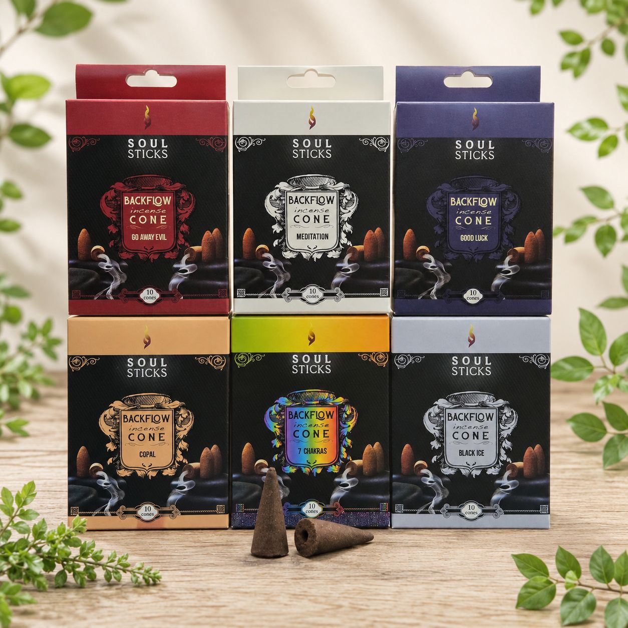 Soul Sticks backflow incense cones in six scents displayed on a light wooden table with greenery.