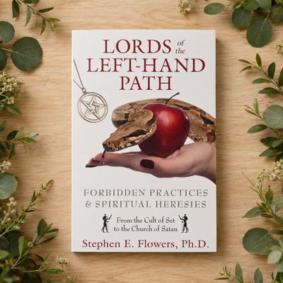 Lords of the Left-Hand Path by Stephen E. Flowers displayed on light wood with greenery.