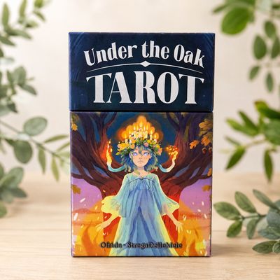 Under the Oak Tarot box with candle-crowned figure and mystical oak tree artwork