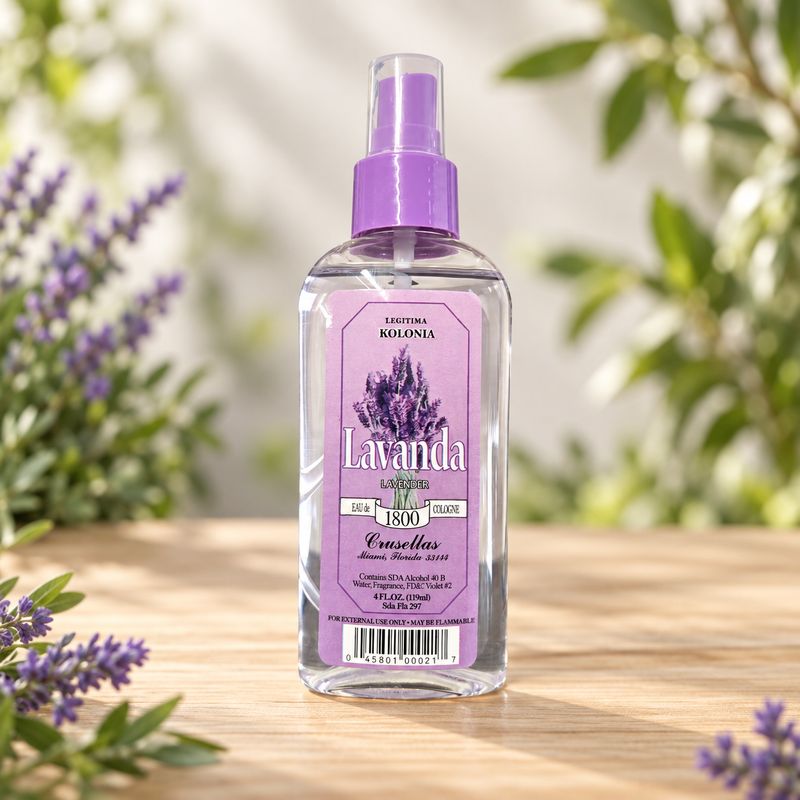 Lavender 1800 Kolonia 4 oz spray bottle on a light wooden table with greenery