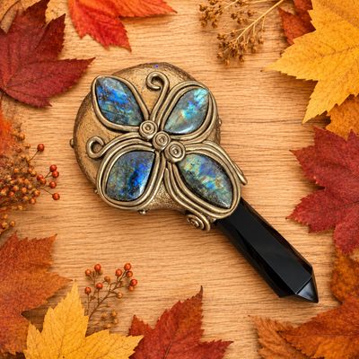 Back of Labradorite black obsidian hand mirror with butterfly stone design and faceted handle
