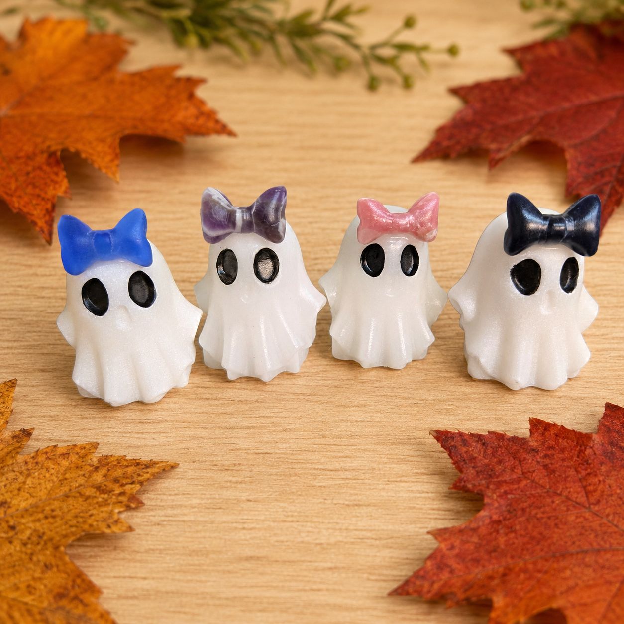 Four White Jade Ghosts with Blue Cat’s Eye, Amethyst, Pink Jade, and Obsidian gemstone bows.