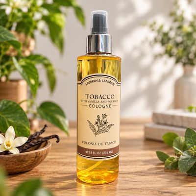 Murray &amp; Lanman Tobacco with Vanilla and Bourbon Cologne 8 oz on a light wooden table with greenery.
