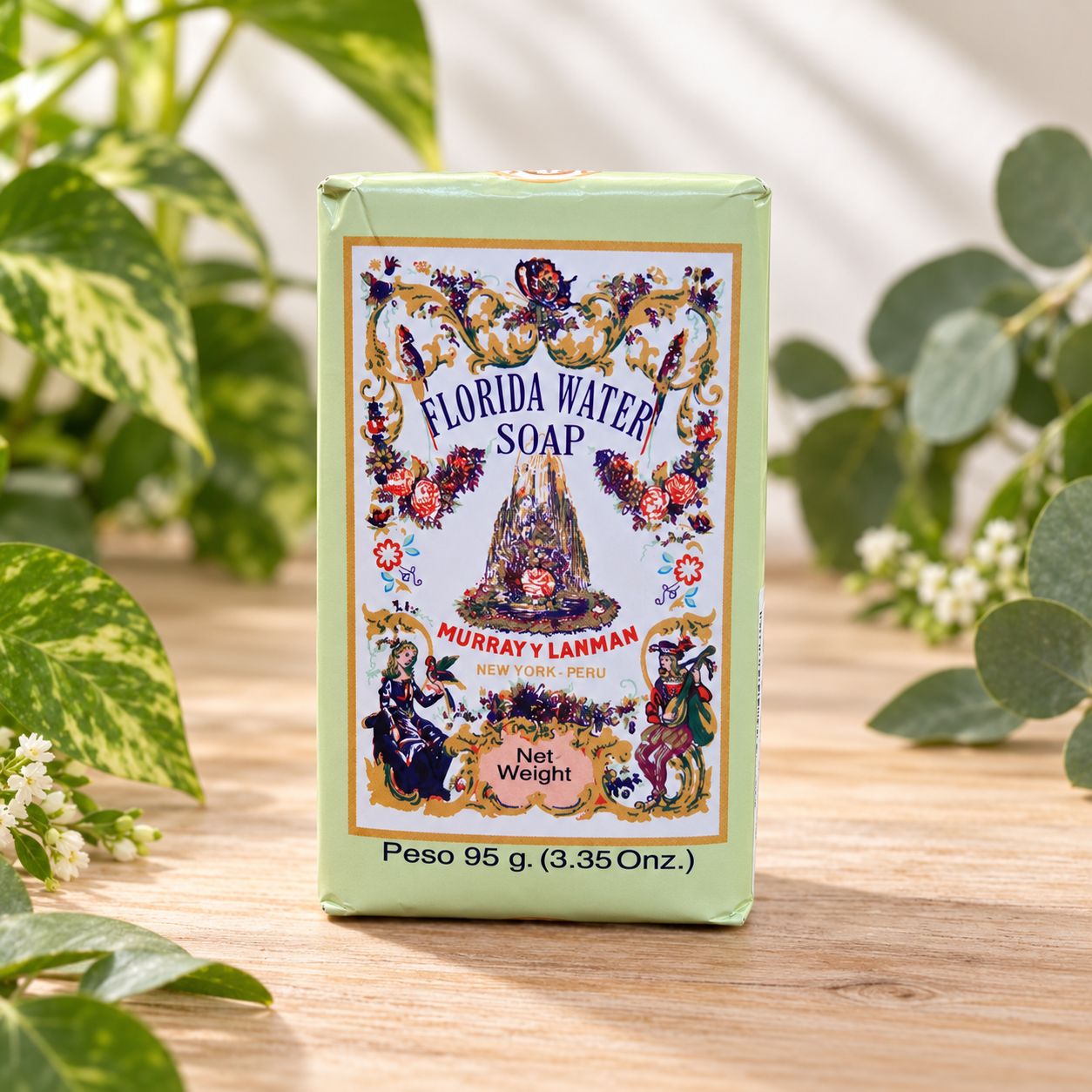 Murray y Lanman Florida Water Soap 95g displayed on a light wooden table with natural greenery.
