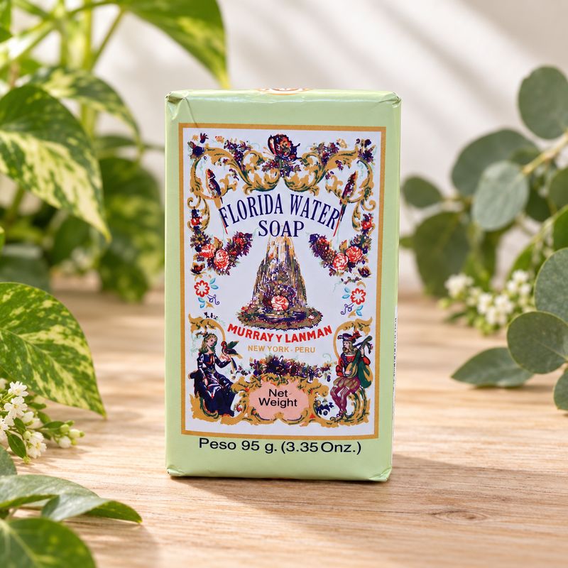 Murray y Lanman Florida Water Soap 95g displayed on a light wooden table with natural greenery.
