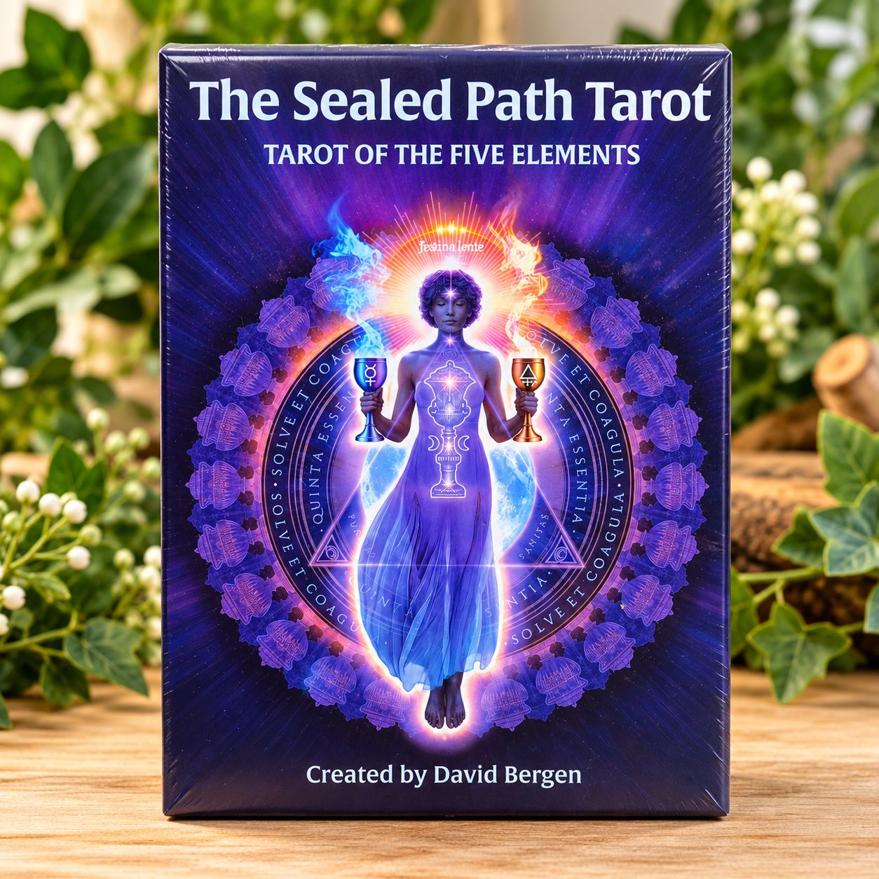 The Sealed Path Tarot by David Bergen, featuring mystical five-element artwork, displayed on a light wooden table with greene