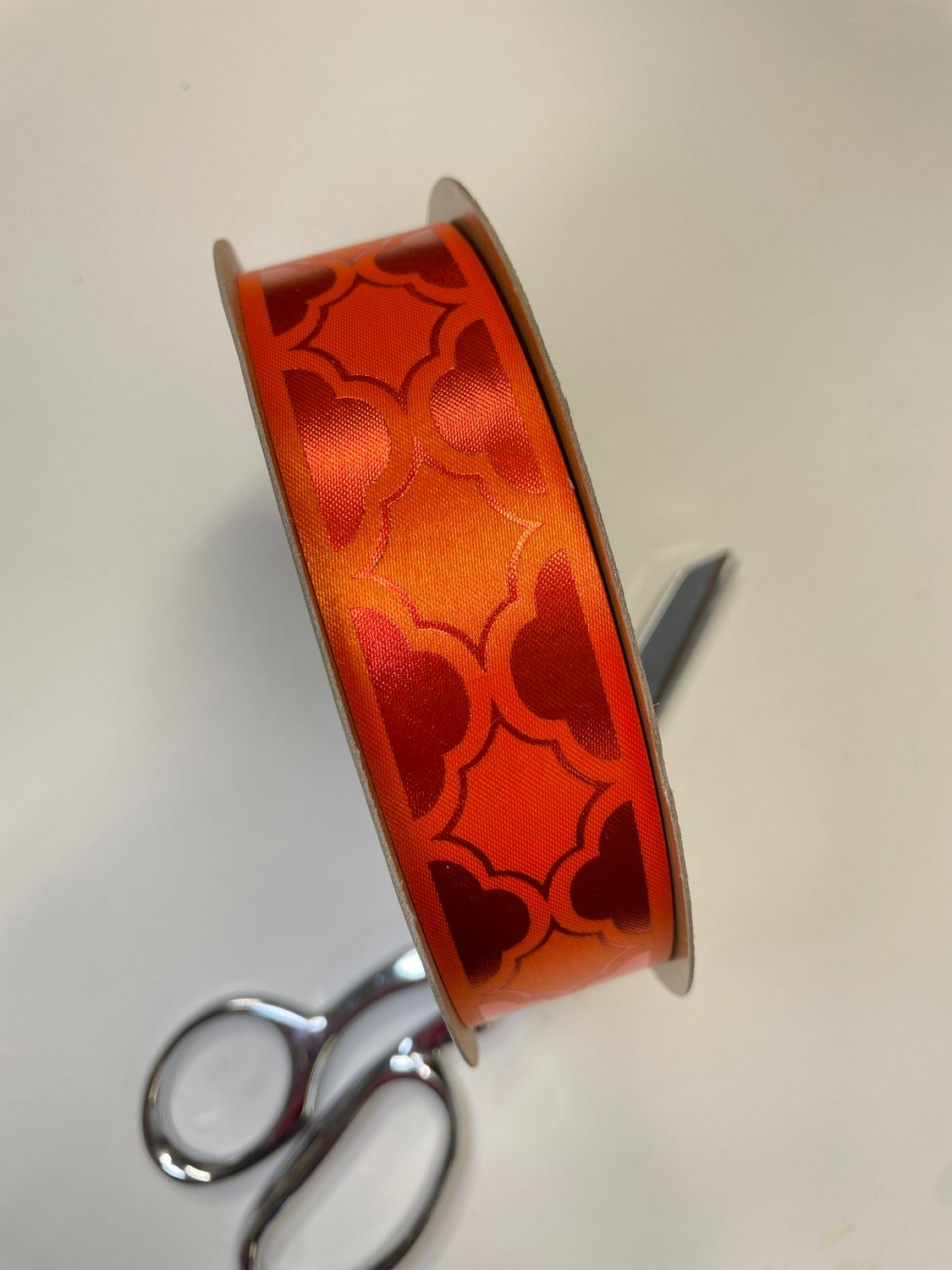 Pre-printed monochrome orange Quatre on orange lustre ribbon- size 9