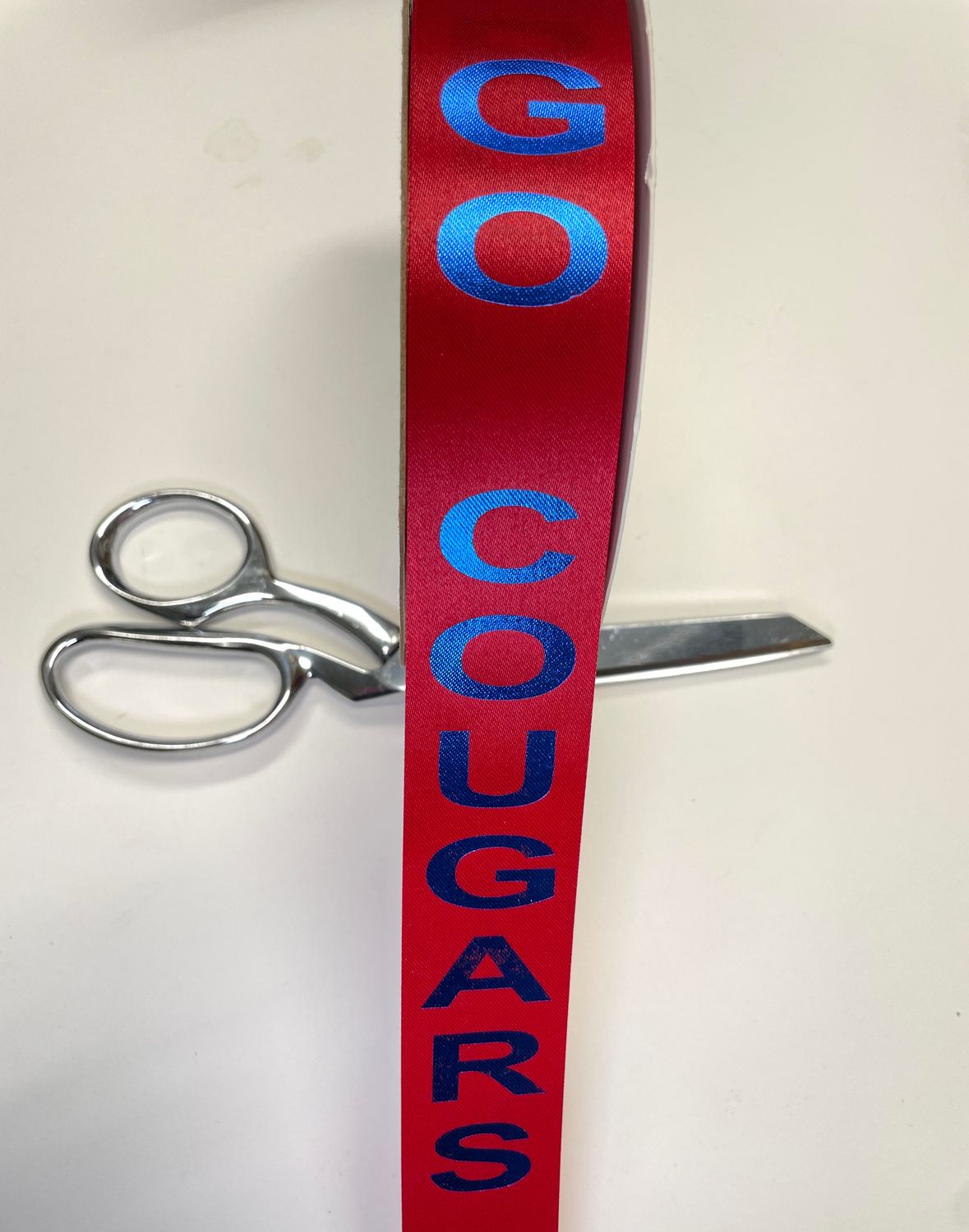 Pre-printed royal blue GO COUGARS on red lustre ribbon- size 9