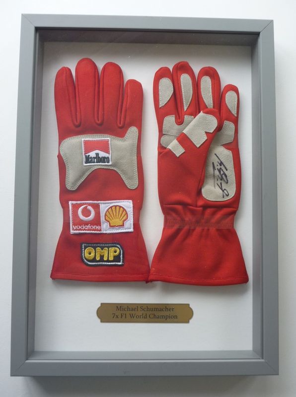 A pair of Michael Schumacher SIGNED racing gloves with COA, in display box