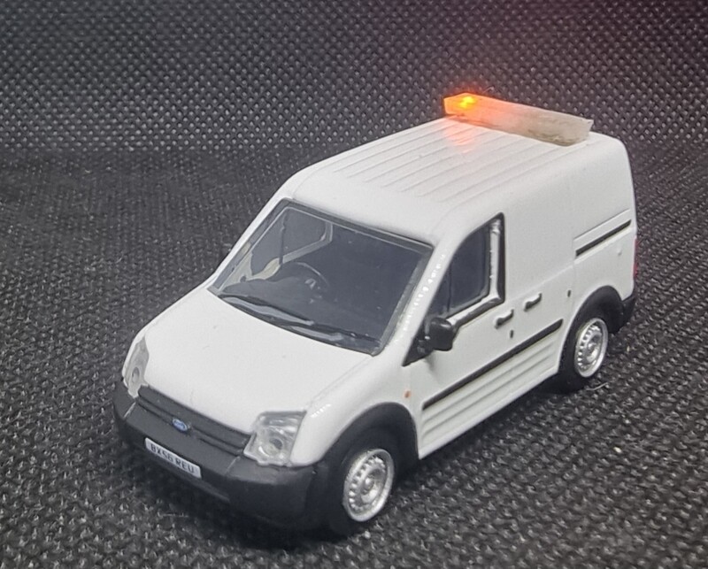 76FTC005 - Ford Transit Connect White fitted with Leigh Models and Hobbies Light Bar