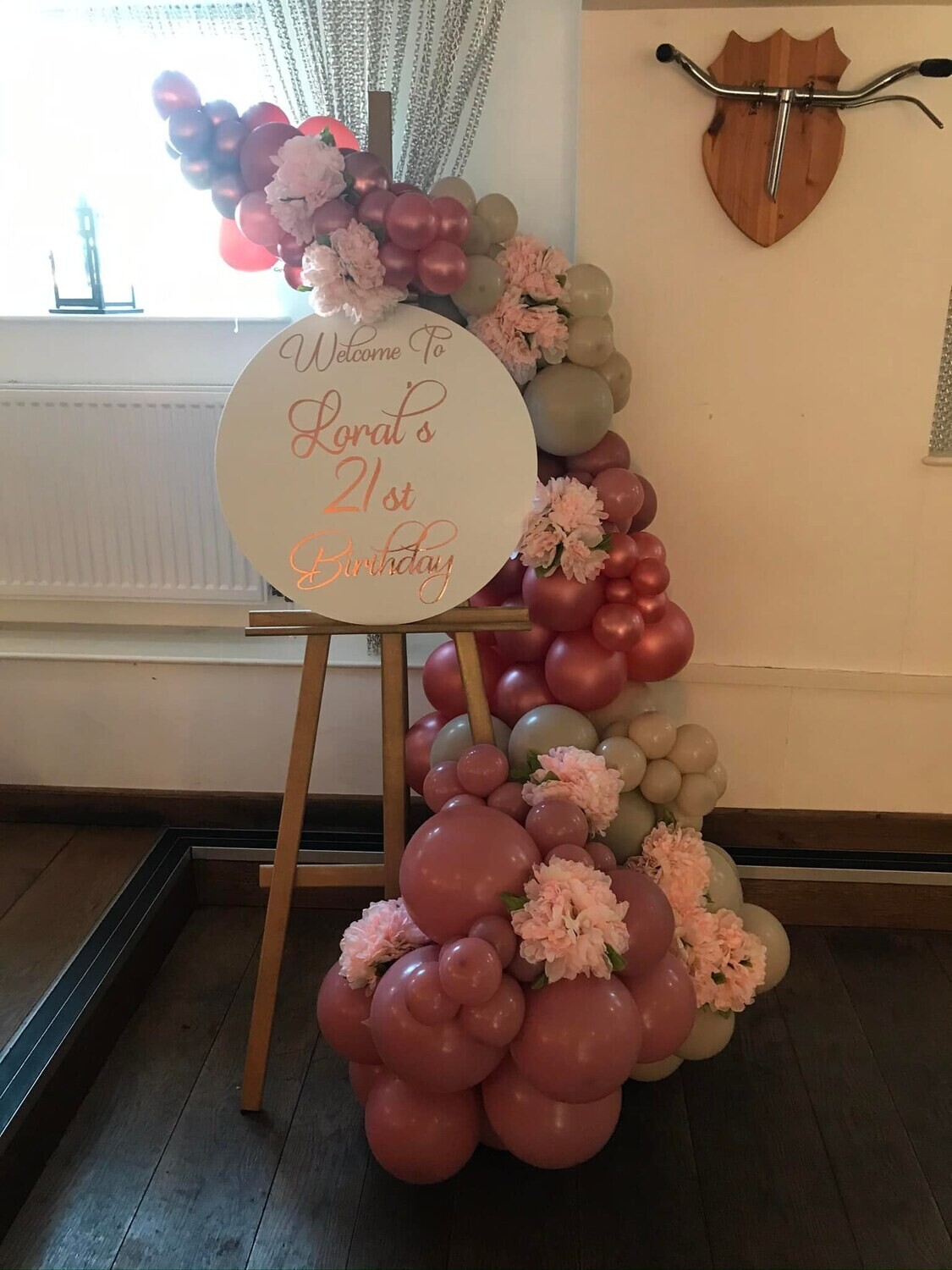 Welcome sign hire with easel and garland