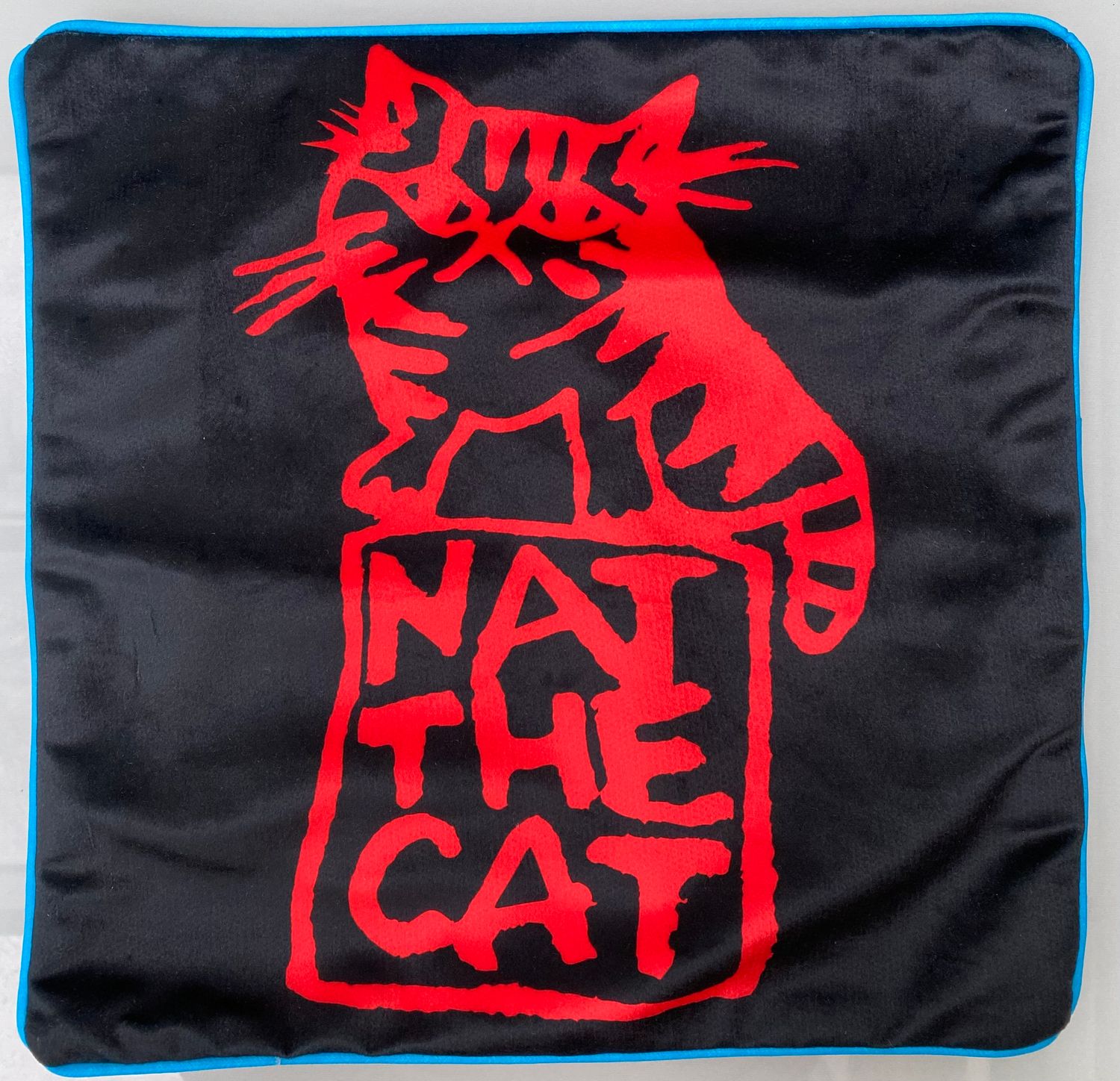 NAT THE CAT CUSHION COVER - Nat The Cat red logo on black